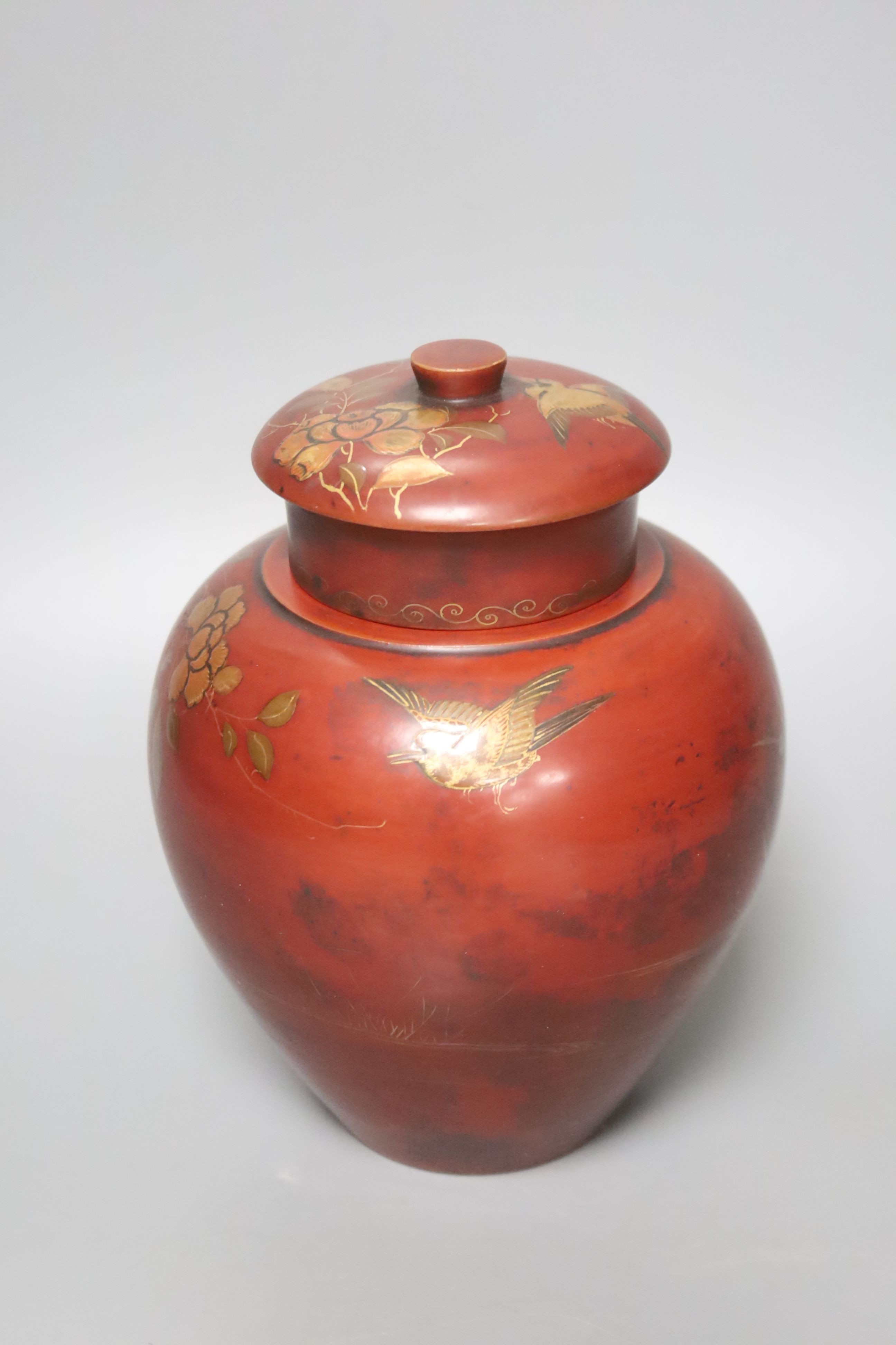 A Chinese red lacquer tobacco jar and cover, height 18cm